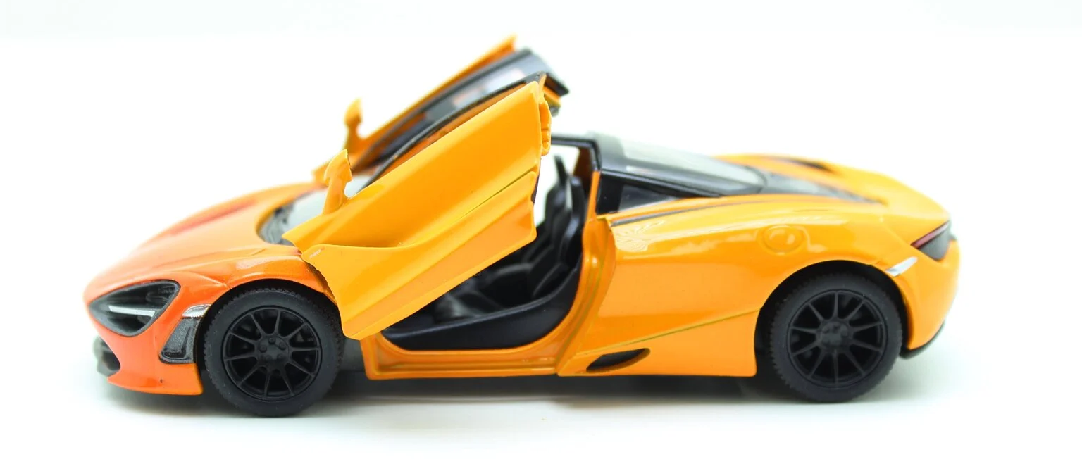 https://storage.alifshop.tj/media/images/alifshop/28318/igrushechnaya-modelka-mclaren-1900-210-metallicheskaya-1-24-oranzhevyy-1734948372269.png
