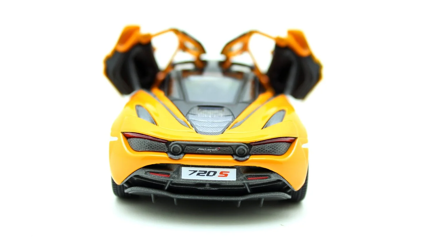 https://storage.alifshop.tj/media/images/alifshop/28318/igrushechnaya-modelka-mclaren-1900-210-metallicheskaya-1-24-oranzhevyy-1734948373667.png