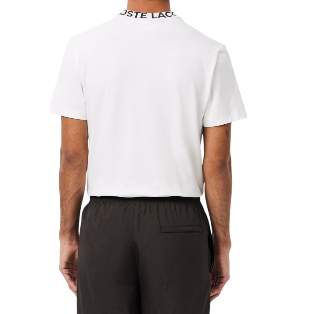 https://storage.alifshop.tj/media/images/alifshop/52461/muzhskaya-futbolka-lacoste-th9582-001-s-belyy-1772015923421.png