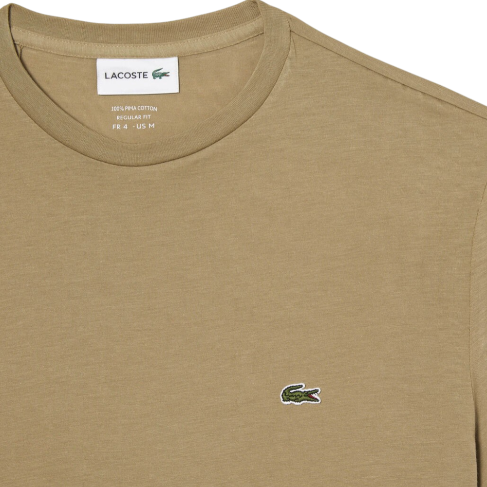 https://storage.alifshop.tj/media/images/alifshop/52537/muzhskaya-futbolka-lacoste-th6709-cb8-s-bezhevyy-1772018405791.png