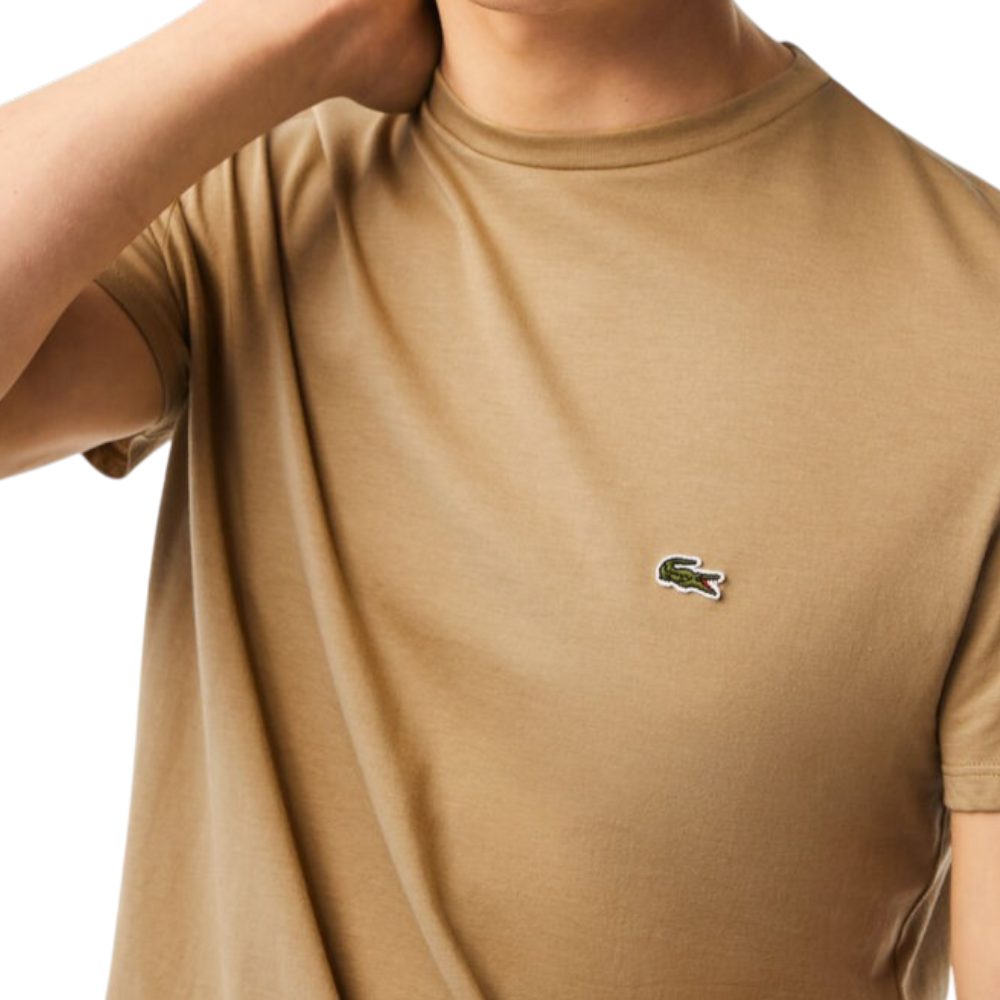 https://storage.alifshop.tj/media/images/alifshop/52539/muzhskaya-futbolka-lacoste-th6709-cb8-l-bezhevyy-1772018470937.png