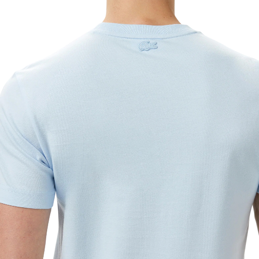 https://storage.alifshop.tj/media/images/alifshop/54571/muzhskaya-futbolka-lacoste-th0527-t01-l-belyy-1774846562538.png