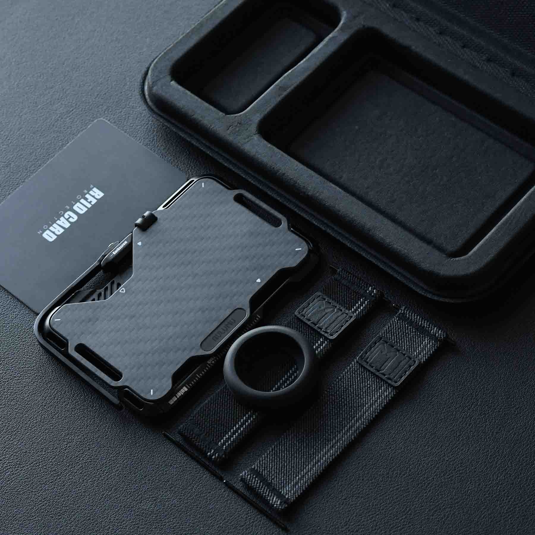 https://storage.alifshop.tj/media/images/alifshop/65763/magnitnyy-metallicheskiy-koshelek-multitul-aulumu-g03-karbon-1789048671875-muxHhY8Z.jpg