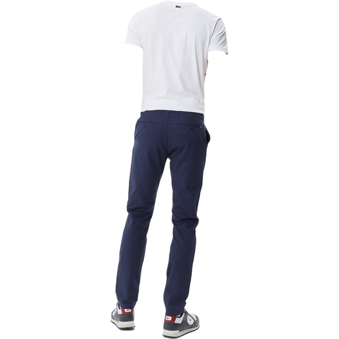 https://storage.alifshop.tj/media/images/alifshop/68577/muzhskie-bryuki-lacoste-hh0331-31l-xl-temno-siniy-1790776145842-k9Hd0zrK.png
